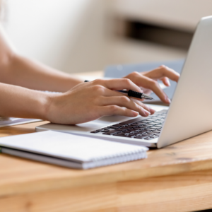 woman typing on laptop training