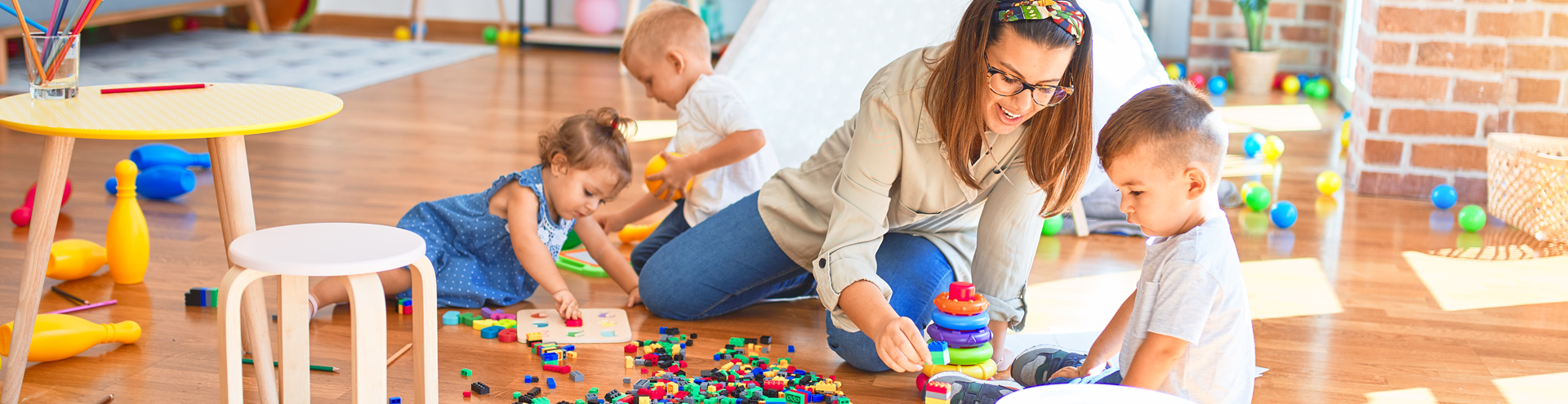 child care provider stacking tower with child