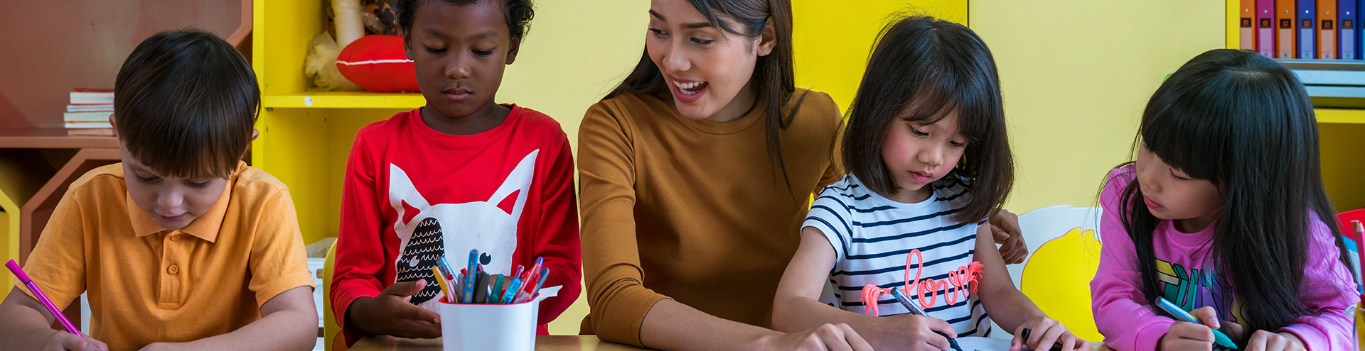 woman smiling playing with children