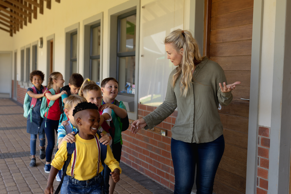 children in line to enter classroom