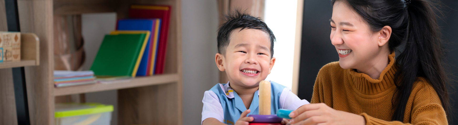 Preschool teacher with child