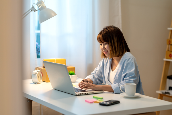 Woman sitting at desk with computer